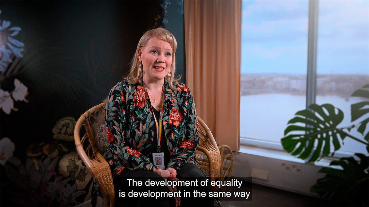 Katri Viippola in a screenshot from a video that is subtitled: The development of equality is development in the same way.